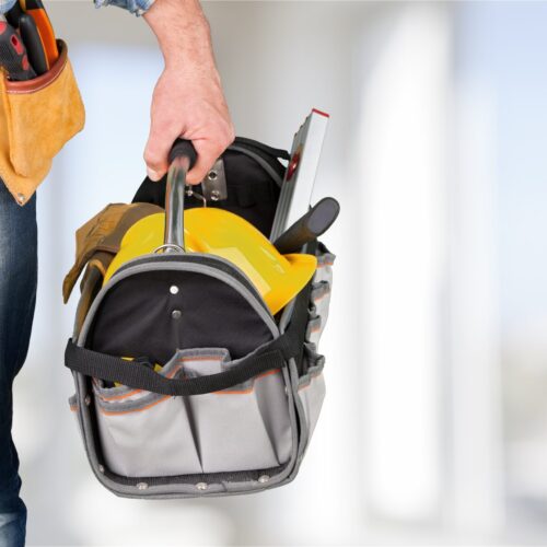 Male worker with tool belt isolated on white  background